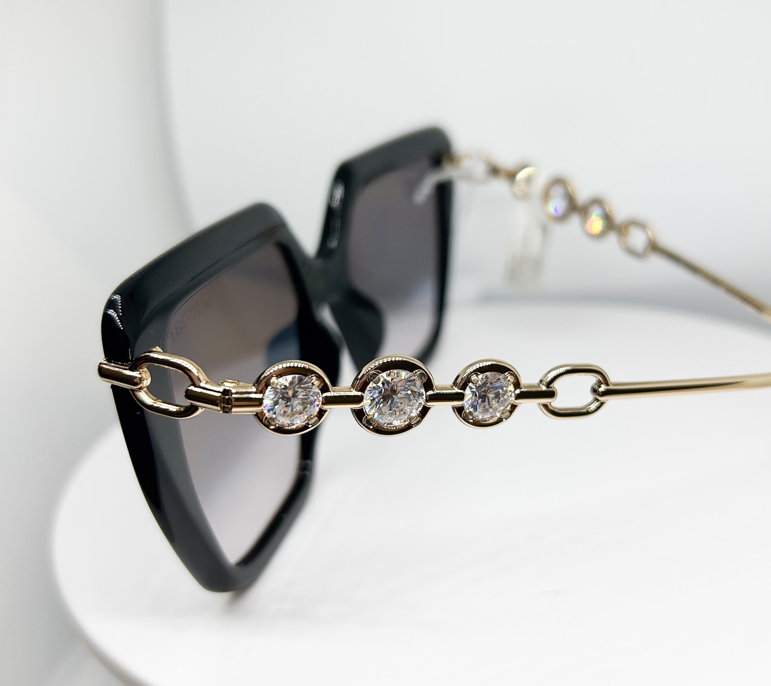 Side of Caviar 6896 that has gold, black; acetate metal sunglasses frame with an Avant Garde shape