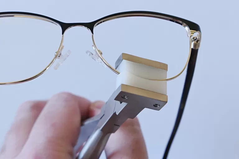 Female eyeglass metal frame eyepiece adjusted with eyewire forming plier
