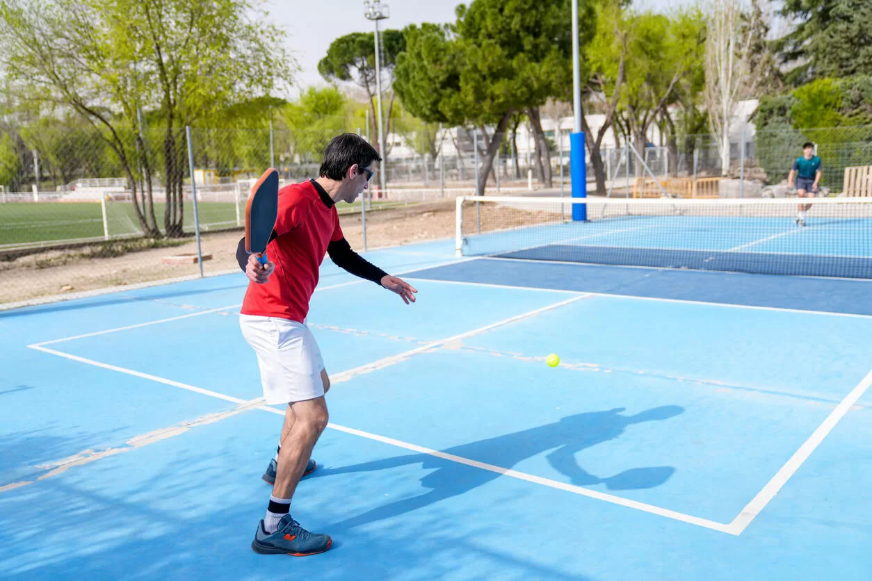 Playing pickleball on a sunny day with RIA sunglasses