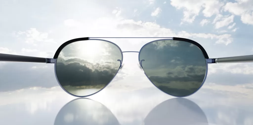 Polarized sunglasses on sunny sky with UV protection